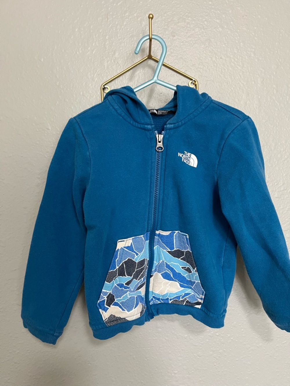The North Face Kids Blue Hooded Zip Fleece with Patterned Pockets